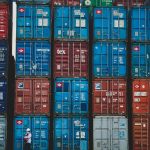 Colorful stacked cargo containers at a shipping yard in Jakarta, Indonesia.